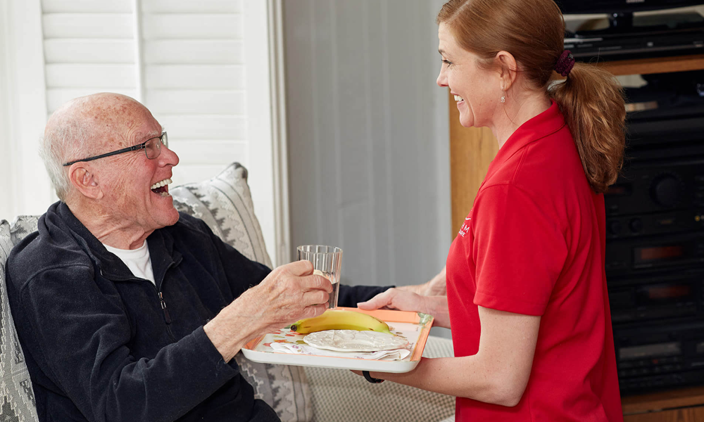 Rhythms Home Care Client and Care Partner Rhythms Home Care care partner and client smiling