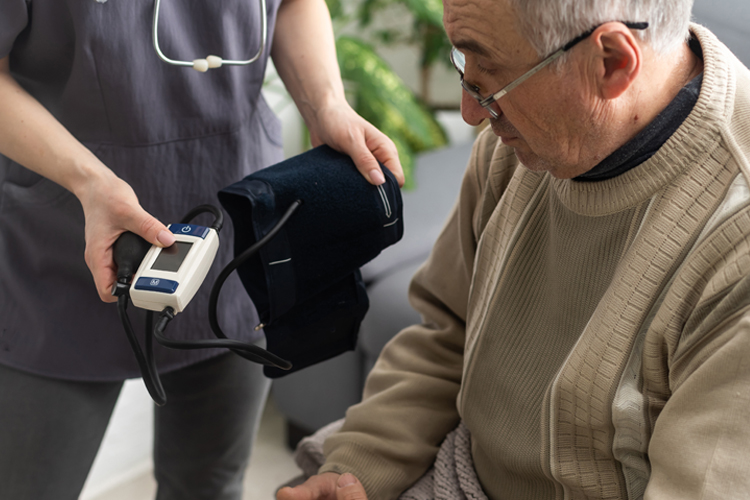 man with blood pressure cuff