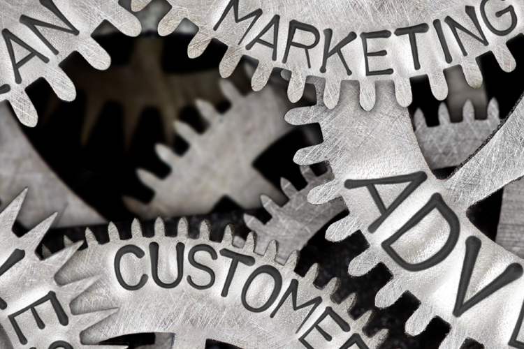 Gears with marketing terms written on them Gears with marketing terms written on them