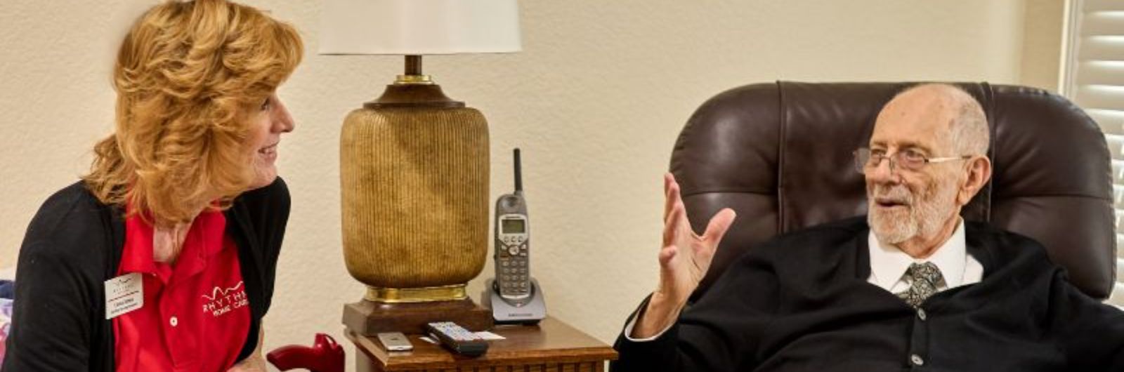 resident having conversation with caregiver square (2)