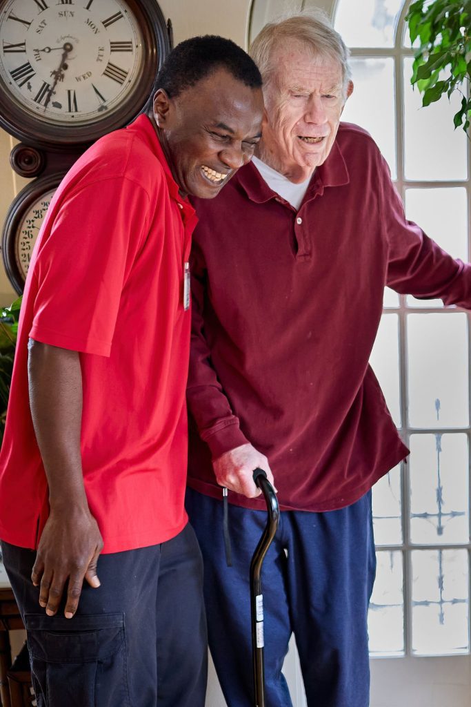 caregiver helping client walk