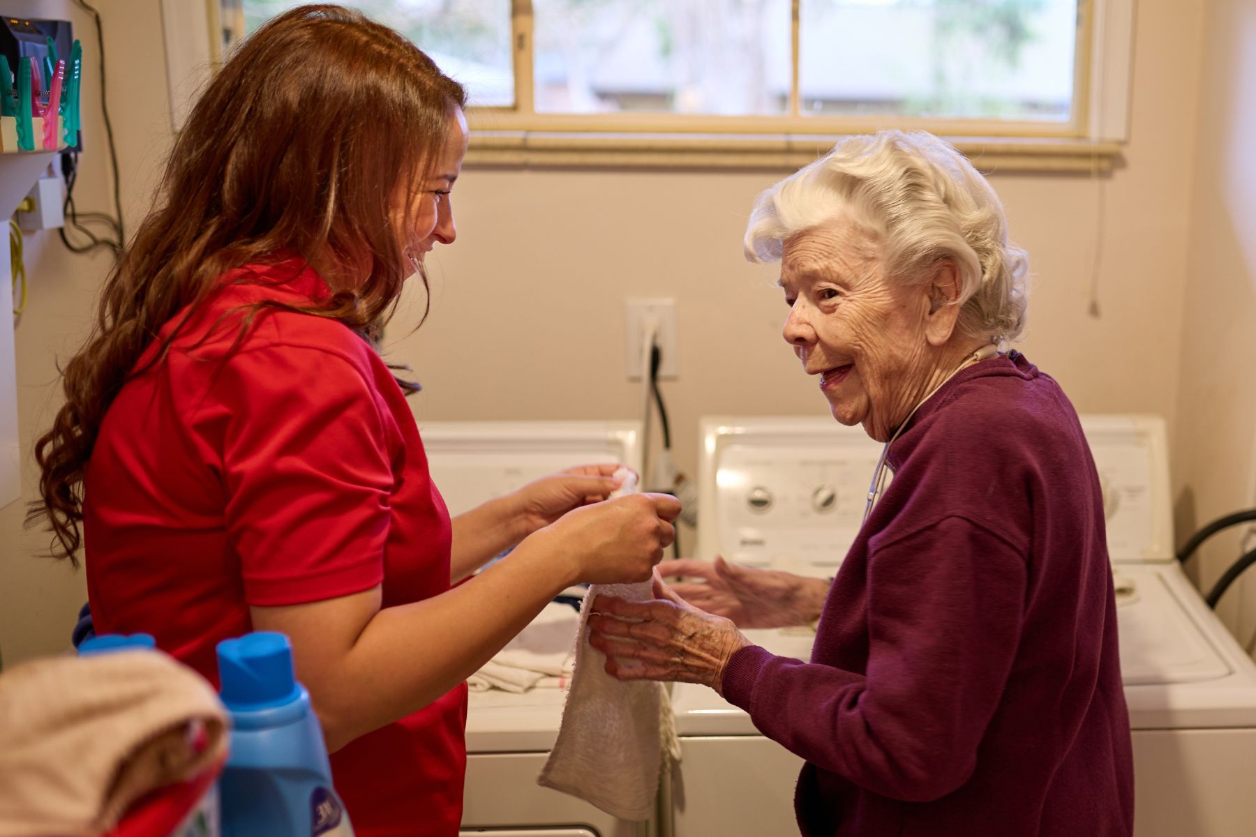 caregiver helping client with laundry