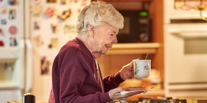 client with cup of tea