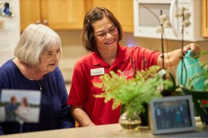 senior home care watering plant landscape