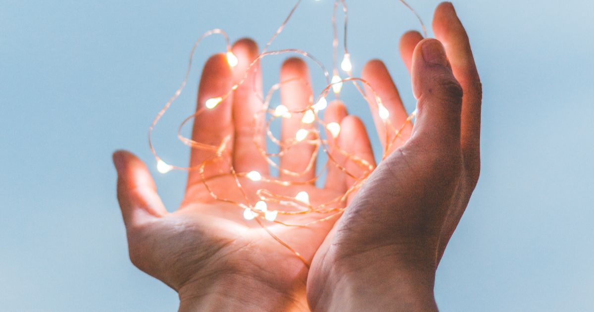 hands with lights diego ph 254975 unsplash