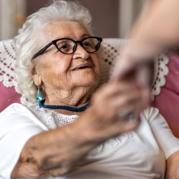 client with caregiver hands